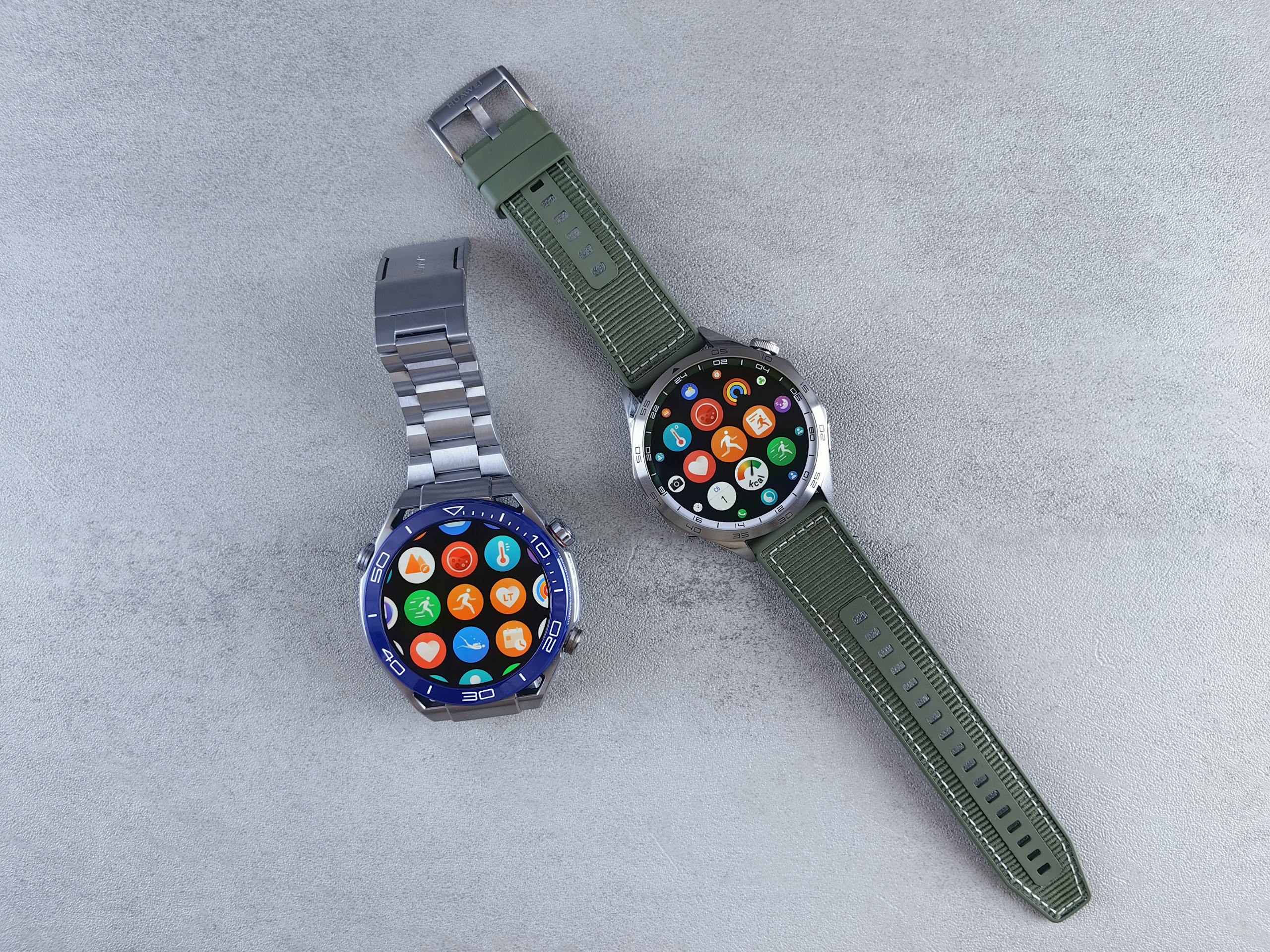Close-up of two smartwatches on a gray background highlighting design and technology.