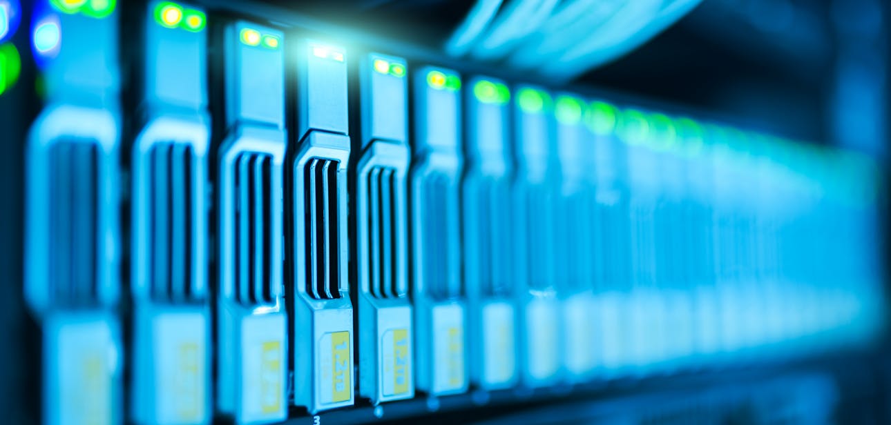 Detailed image of a server rack with glowing lights in a modern data center.