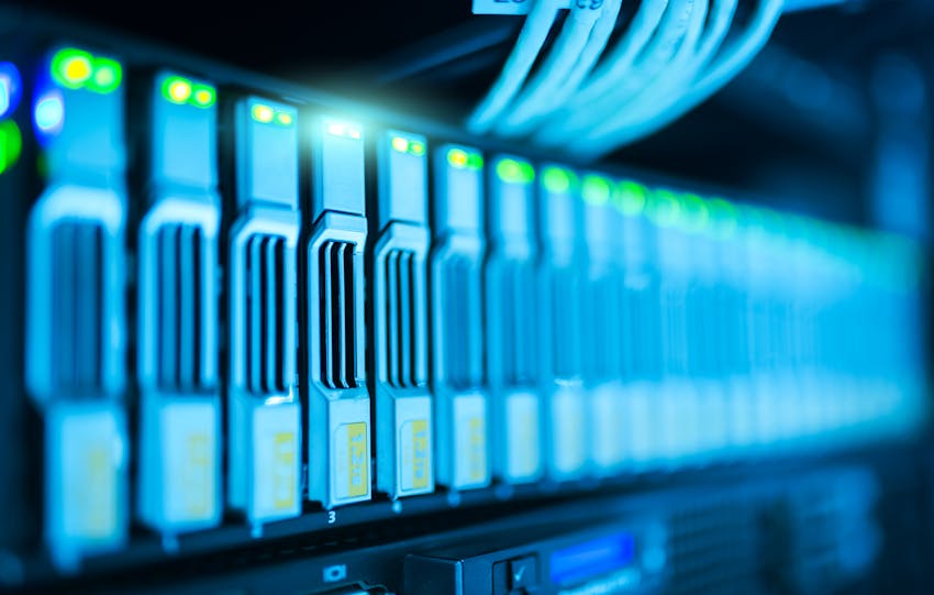 Detailed image of a server rack with glowing lights in a modern data center.
